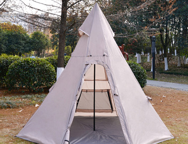 4-5 people camping outdoors in peaked tents