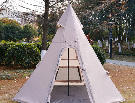 4-5 people camping outdoors in peaked tents